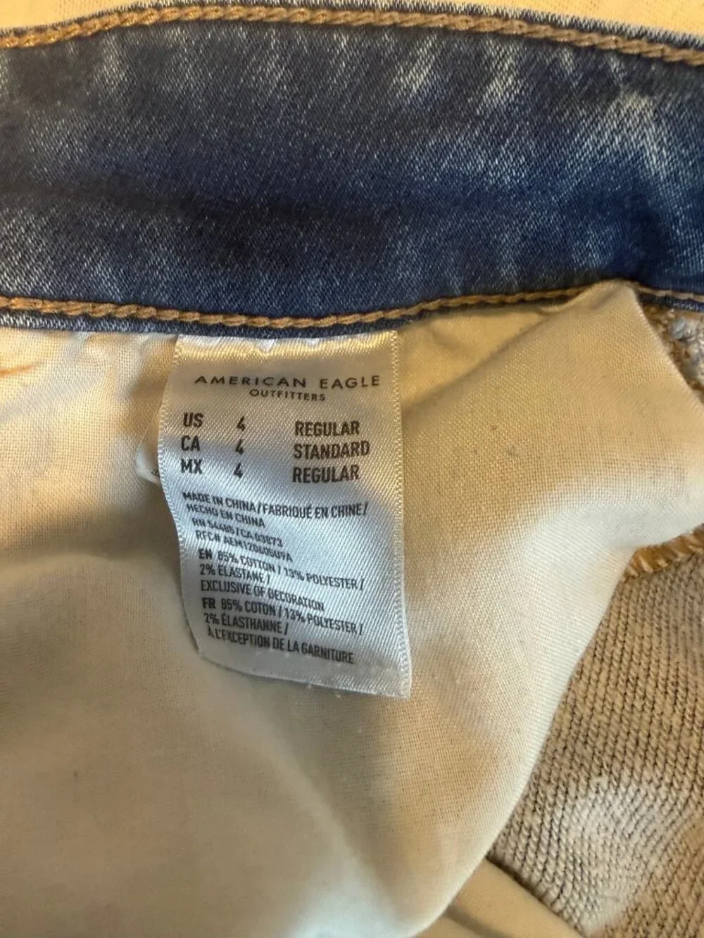 American Eagle hi Rise Jeans Size 4 Medium Blue Cotton Spandex Jeggings Raw Hem